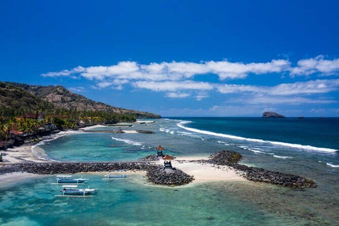 Full Day Private Tour East Bali Sightseeing - All Inclusive - Taman Ujung Water Palace: pools, historic structures, and Mount Agung in the frame