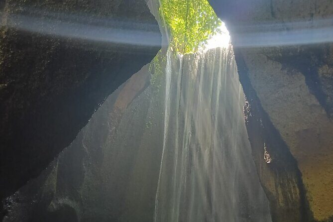 The Fantastic East Of Bali Private Guided Tour - Stop 3: Tukad Cepung Waterfall—cave walking and when photos work